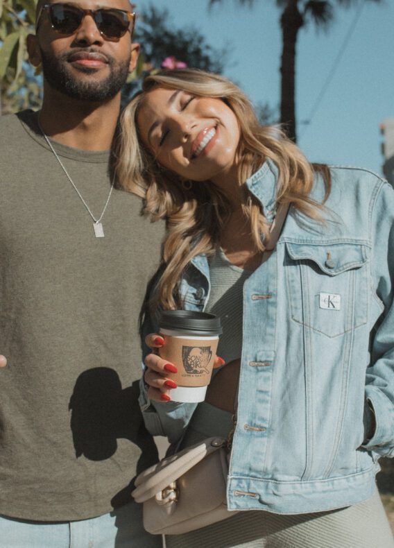 Couple holding coffees on Roosevelt Row downtown Phoenix