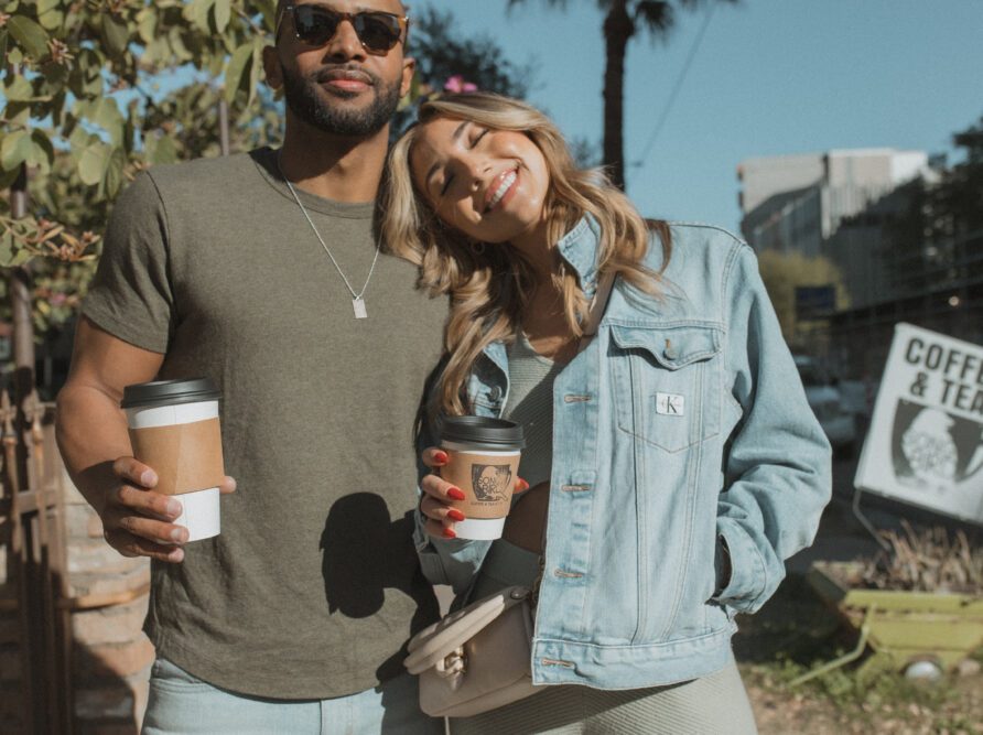 Couple holding coffees on Roosevelt Row downtown Phoenix